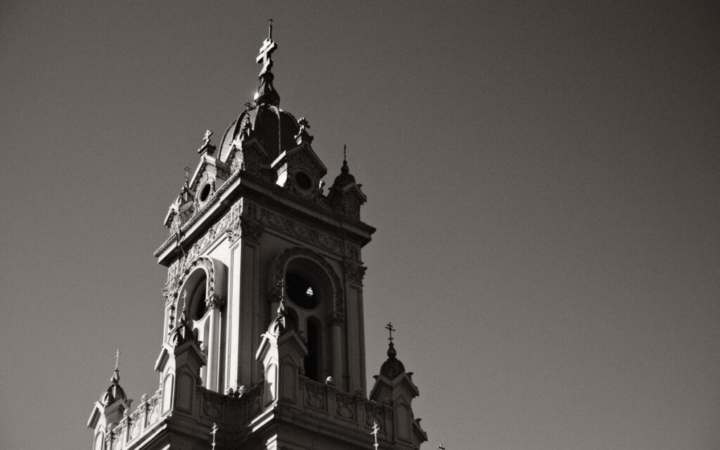 A dramatic low angle view of the historic St. Stephen Church tower in Istanbul, Turkey.