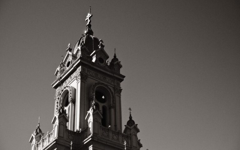 A dramatic low angle view of the historic St. Stephen Church tower in Istanbul, Turkey.