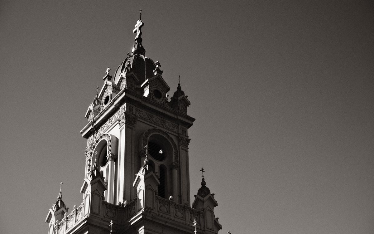 A dramatic low angle view of the historic St. Stephen Church tower in Istanbul, Turkey.