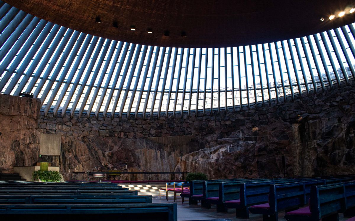 Explore the architectural beauty of Helsinki's rock church with natural light.