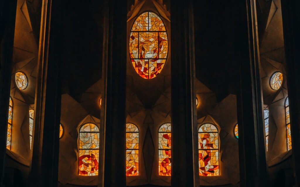 Intricate stained glass windows inside Sagrada Familia, Barcelona.
