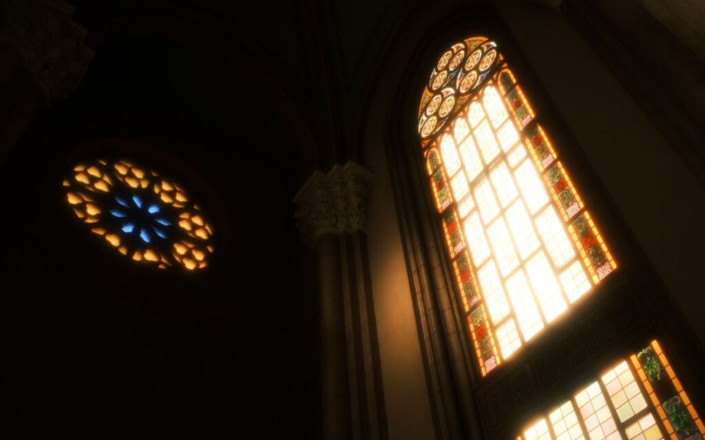 Low angle view of illuminated stained glass windows in a historic church interior.