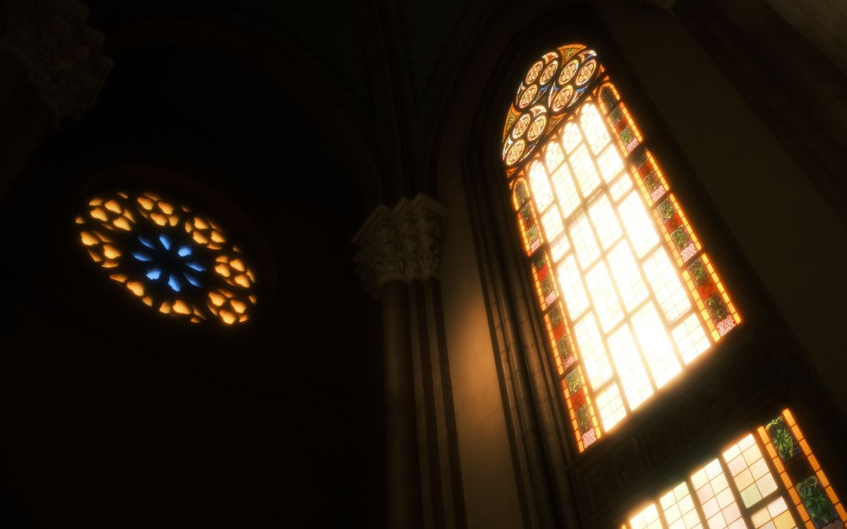 Low angle view of illuminated stained glass windows in a historic church interior.