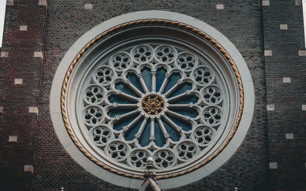 Close-up of a detailed rose window showcasing stunning Gothic architectural design.