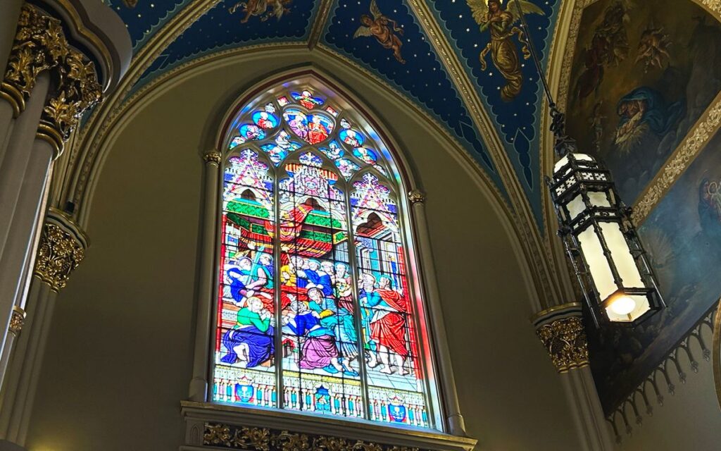 Vibrant stained glass window inside the Basilica of the Sacred Heart at Notre Dame, Indiana.